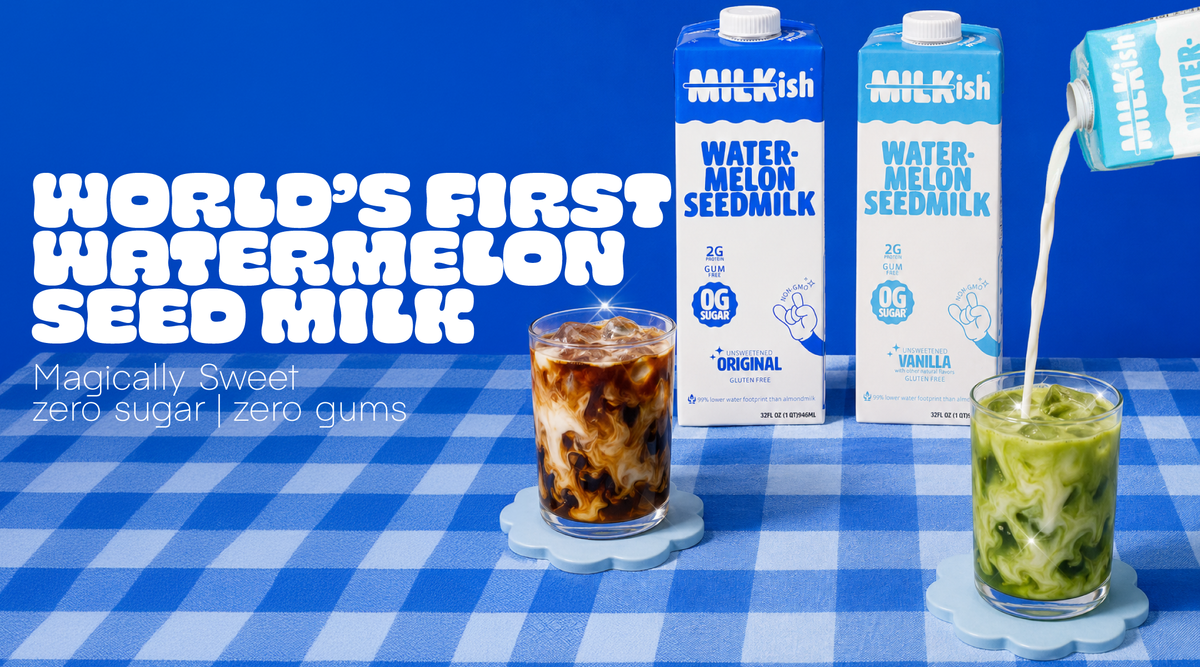 Two Milkish Watermelon Seed Milk cartons on a blue-and-white checkered tablecloth, with one carton being poured into an iced matcha and another glass containing a iced coffee beside it. Large text on the left reads 'WORLD'S FIRST WATERMELON SEED MILK' with smaller copy below that reads 'zero sugar zero gums'